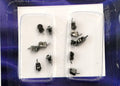 1:12 scale miniature furniture casters in metallic gray, set of 12, shown in clear blister packaging