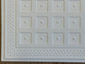 1:12 scale miniature coffered ceiling panel in white embossed foam board with square panels and patterned border