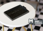 1:12 scale miniature wood tray in black, rectangular with raised rim, shown on a round white table