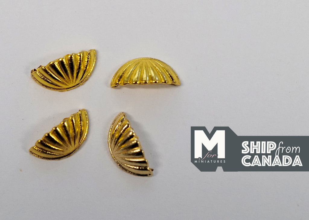 1:12 scale miniature gold half moon cabinet pulls with ribbed shell design, set of 4, on a white surface