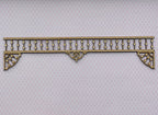 1:12 scale miniature unpainted spool spindle porch trim with scrolled corner brackets, lying on a light background