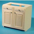 1:12 scale miniature wood kitchen base cabinet kit with 2 doors, shown assembled and unpainted on a blue background