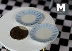 1:12 scale miniature ceramic scalloped plates in pale blue with fluted rims, set of 2, shown beside a coin for scale
