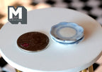 1:12 scale miniature ceramic small plates with scalloped blue rim, set of 2, blue and white, stacked beside a coin