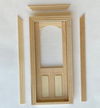 1:12 scale miniature unfinished wood 2 panel door with arched window opening and back trim, shown with loose trim pieces