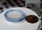 1:12 scale miniature ceramic oval plates with blue rim, set of 2, blue and white, stacked beside a coin for scale