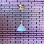 1:12 scale miniature hanging ceiling lamp with frosted cone shade, battery powered, brass ceiling plate, shown by a brick wall