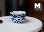 1:12 scale miniature ceramic scalloped bowls with blue pattern, set of 2, blue and white, stacked on a white table
