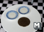1:12 scale miniature ceramic small plates with blue border pattern, set of 2, blue and white, shown beside a coin