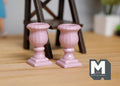 1:12 scale miniature pink Roman style pedestal urn planters with fluted bowls, set of 2, on a wood floor