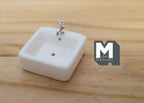 1:12 scale miniature ceramic square vessel sink in white with a silver faucet, shown on a wood surface