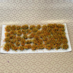 1:12 scale miniature assorted flower cluster, irregular yellow and orange blossoms on a peel off sticker backing sheet