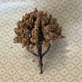1:12 scale miniature bushy tree with dried look brown foliage and dark branching trunk, shown lying on patterned paper