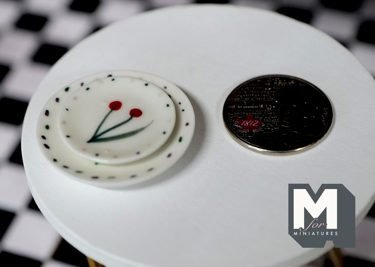 1:12 scale miniature ceramic plates, large and medium set of 2, white with red flowers and dotted rim, beside a coin
