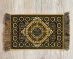 1:12 scale miniature large wool area rug with fringe in brown, gold and black medallion pattern, on a wood floor