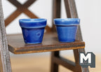 1:12 scale miniature cobalt blue ceramic flower pots with glossy glaze, set of 2, shown on a dark wood shelf