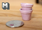 1:12 scale miniature ceramic round flower pots in pink, large, set of 2, shown stacked beside a coin for scale