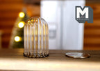 1:12 scale miniature large ribbed glass dome on a bronze metal base, shown beside a coin on a wood table
