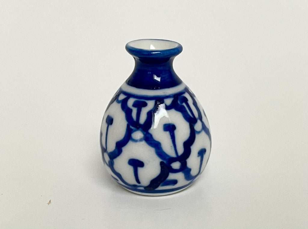 1:12 scale miniature ceramic round vase with blue and white floral pattern and narrow neck, on a white background