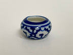 1:12 scale miniature ceramic flower pot, round with blue and white floral pattern, shown on a white surface