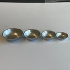 1:12 scale miniature aluminum mixing bowls, set of 4 graduated sizes, silver finish, shown lined up in a row