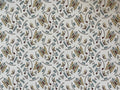 1:12 scale miniature geometric butterfly wallpaper, tan and teal butterflies with small leaves on a cream background
