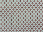 1:12 scale miniature red quatrefoil pattern wallpaper on white, with small red star motifs in a repeating lattice