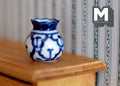 1:12 scale miniature ceramic round vase with flared lip, blue and white floral pattern, shown on a wood shelf