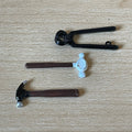 1:12 scale miniature metal hammers and pincers, set of 3 with dark handles, laid out on a wood surface
