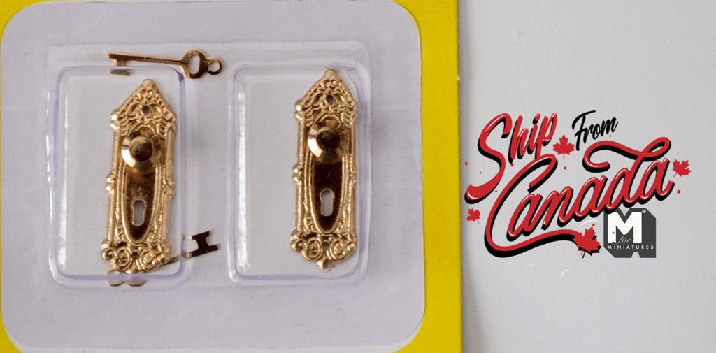 1:12 scale miniature door knobs with ornate backplates and keys in brass, set of 2, shown in clear packaging