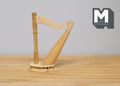 1:12 scale miniature lever harp, unstrung Celtic harp, unfinished and ready to paint, shown on a wood table