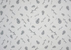 1:12 scale miniature white leaf sprig peel and stick wallpaper with gray pine cones and twigs, close view