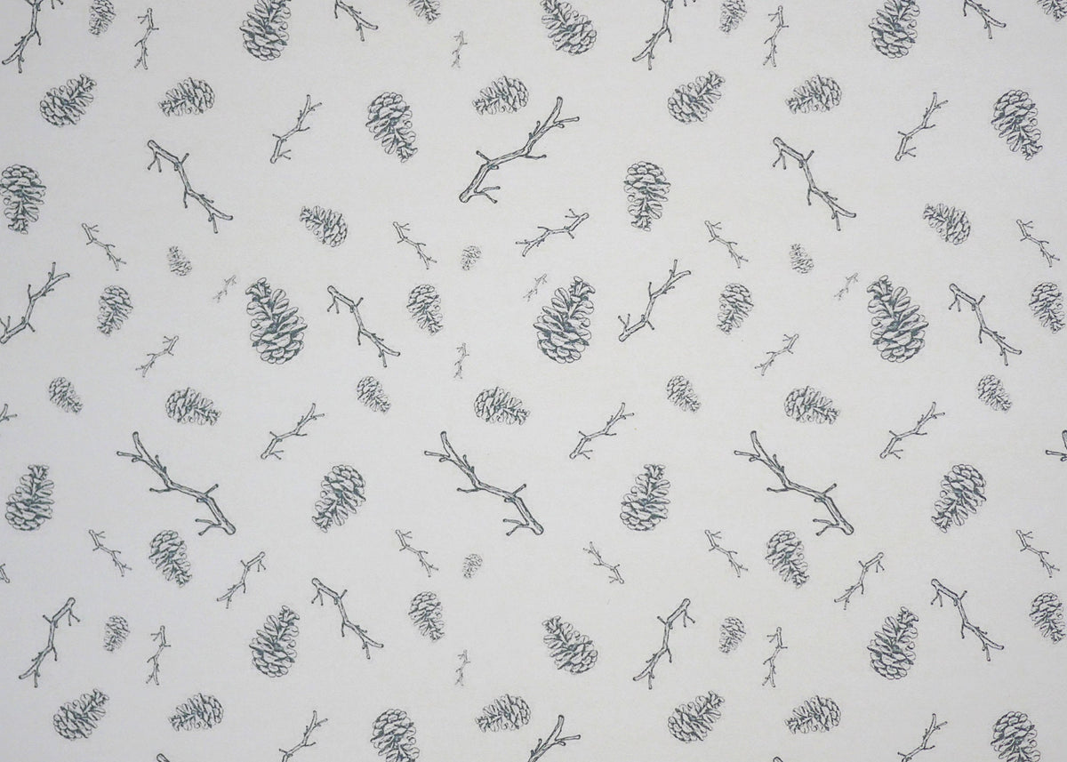 1:12 scale miniature white leaf sprig peel and stick wallpaper with gray pine cones and twigs, close view
