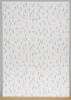 1:12 scale miniature moon and star peel and stick wallpaper in white with small gold moons and dark stars, full sheet
