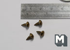 1:12 scale miniature antique brass domed cabinet knobs with pin backs, set of 4, shown with a ruler for scale