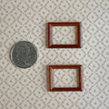 1:12 scale miniature rectangular picture frames in mahogany, set of 2, empty, shown beside a coin for scale