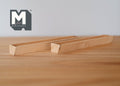 1:12 scale miniature rectangular wood window box planter in natural unfinished wood, shown on a wood table