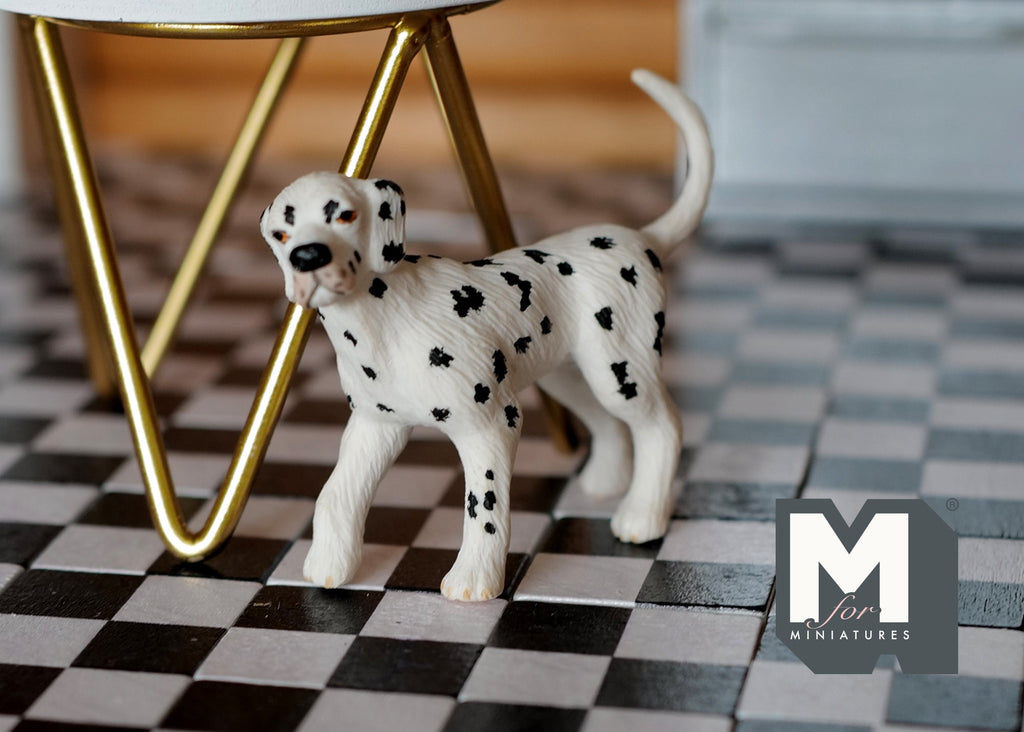1:12 scale miniature standing Dalmatian dog in white with black spots, shown on a black and white checkered floor