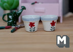 1:12 scale miniature ceramic round flower pots in white with a red flower and blue rim, large, set of 2