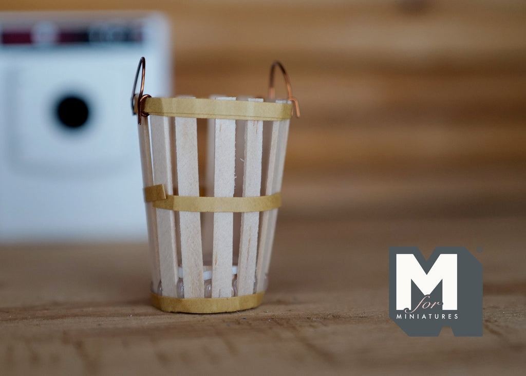 1:12 scale miniature wood slat bucket in cream with metal bands and wire handle, shown on a wood surface