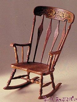 1:12 scale miniature arrowback rocking chair kit with decal, shown assembled and stained brown with a decorated top rail