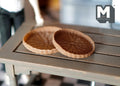 1:12 scale miniature brown round woven trays, set of 2, shallow basket style, shown on a gray wood table
