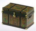 1:12 scale miniature lithographed wood trunk kit with green and orange printed panels and brass corners, shown assembled