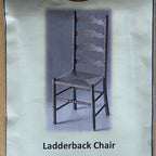 1:12 scale miniature ladderback chair kit, dark chair with four shaped back slats and woven seat shown on the package