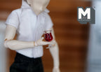 1:12 scale miniature glasses of red wine, set of 2, clear tumbler glass shown held by a jointed doll figure