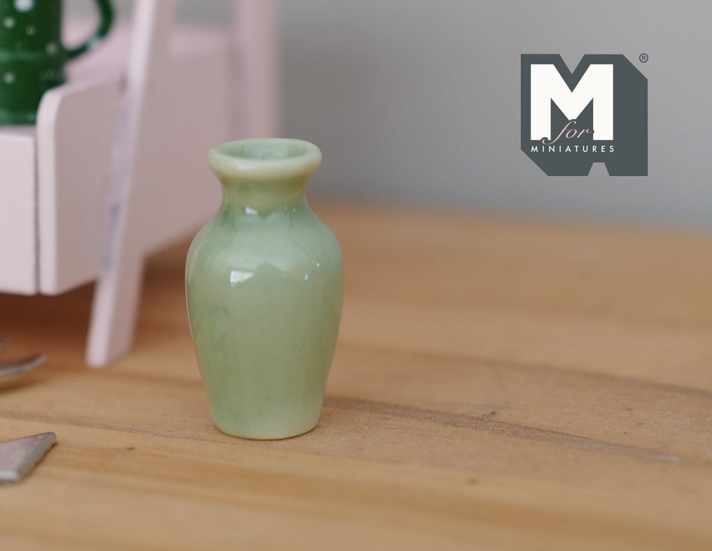 1:12 scale miniature celadon green ceramic baluster vase with narrow neck, shown on a wood table