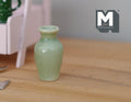 1:12 scale miniature celadon green ceramic baluster vase with narrow neck, shown on a wood table
