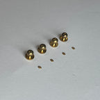 1:12 scale miniature domed door knobs with backplates in brass, set of 4, shown on a white surface