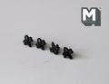 1:12 scale miniature matte black fleur de lis cabinet knobs, set of 4, lined up on a white surface