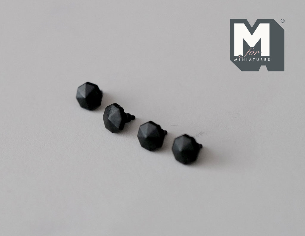 1:12 scale miniature octagon pyramid knobs in matte black, set of 4, shown in a row on a gray surface